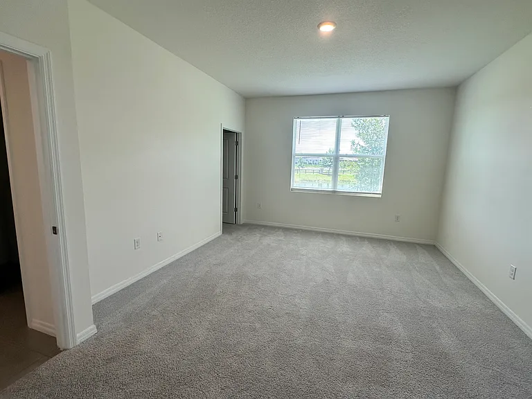 Primary bedroom with 2 walk-in closets.