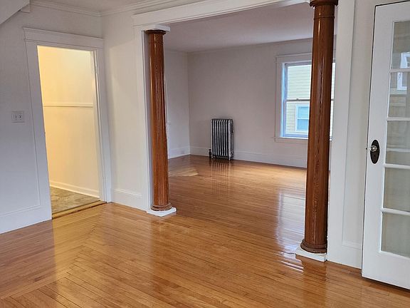 Spacious formal dining room, perfect for work-from-home, bright and sunny with original bay window and fixtures