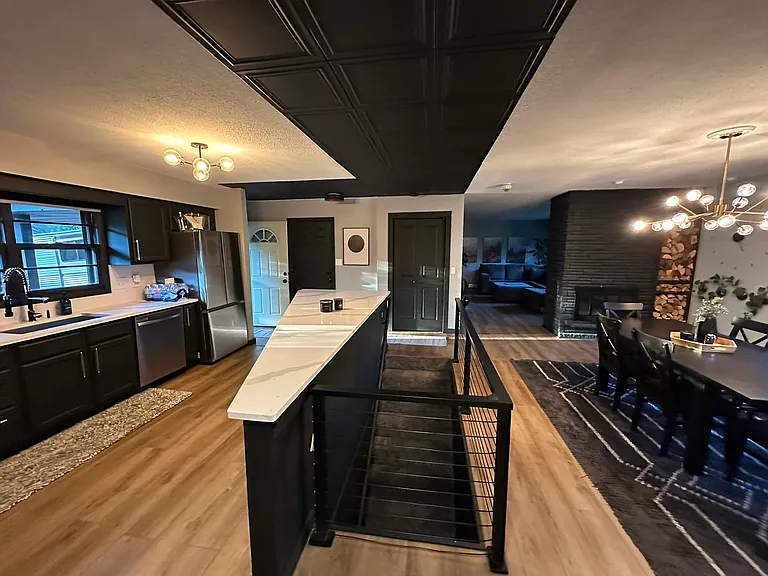 Open design connects the kitchen, dining and living rooms.