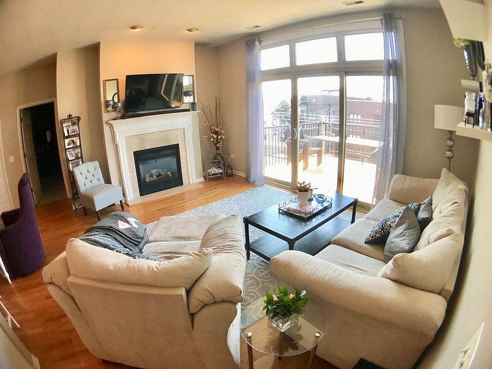 Living room, hardwood floor, fireplace, private balcony off of living room.