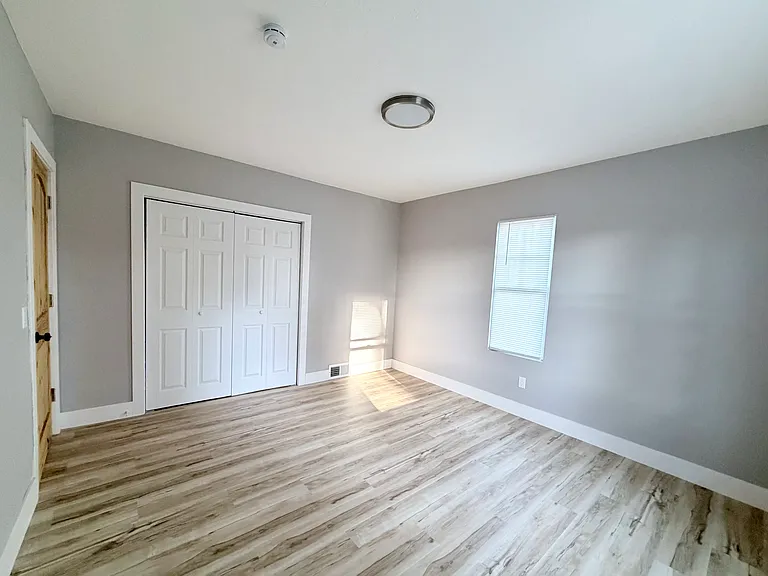 Spacious Master Bedroom 1/6 with large closet, new flooring, and lots of natural light