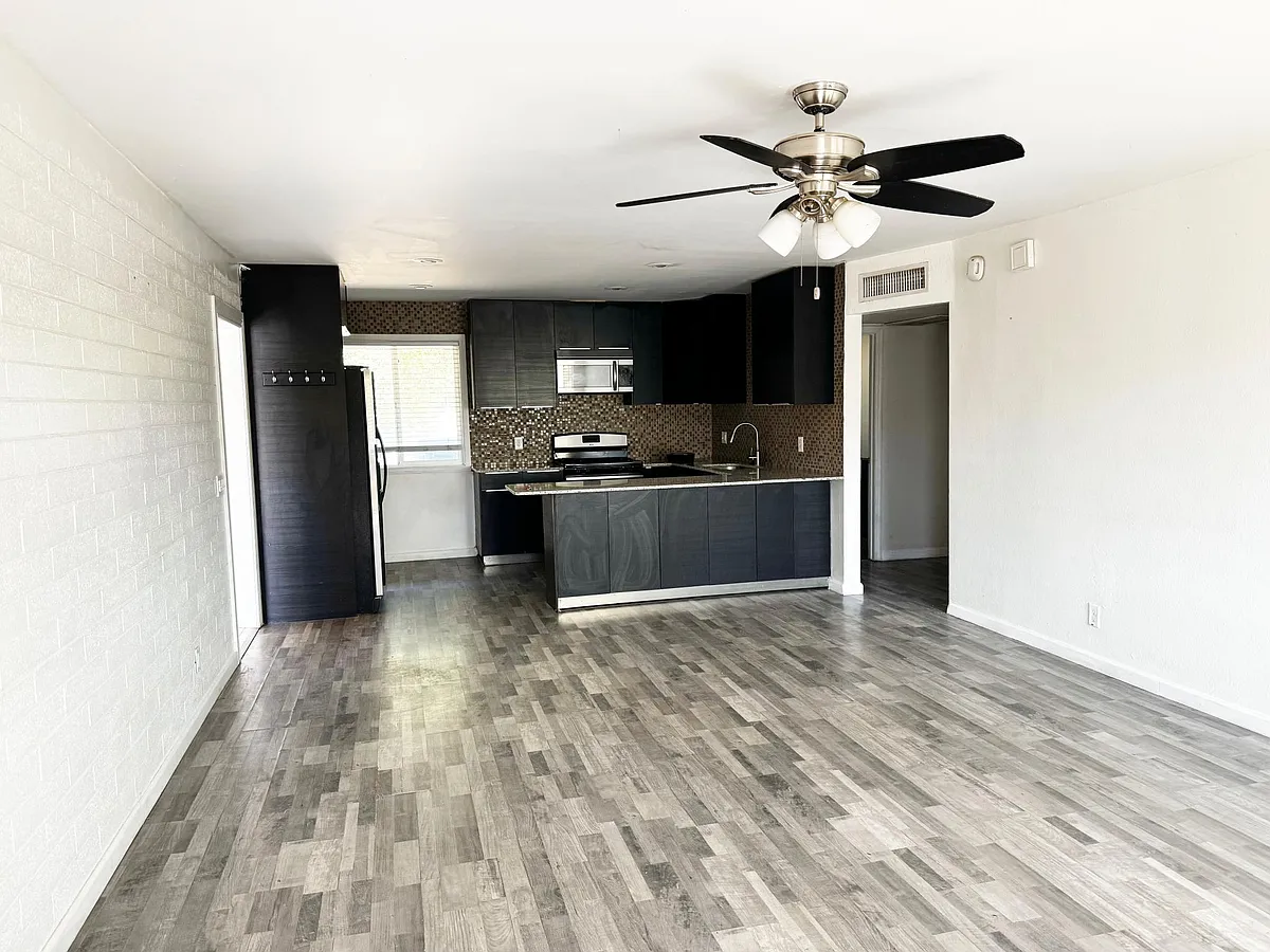 Large great room with LVP flooring - 7657 N 12th St #A