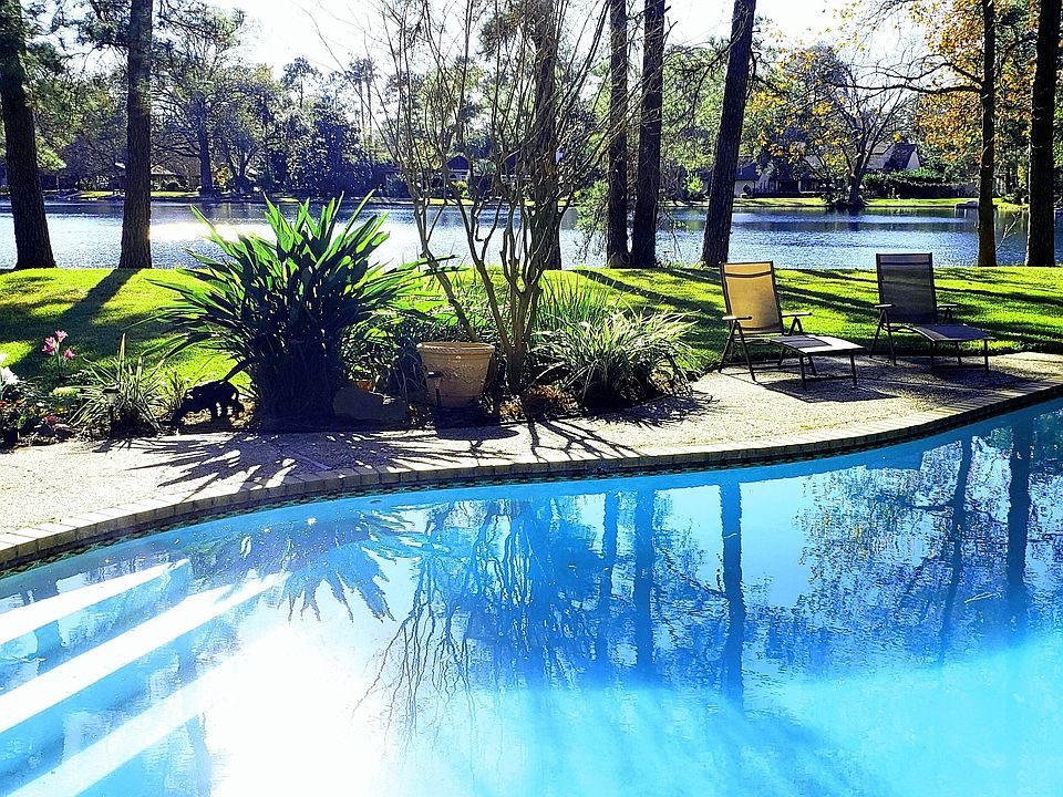 Tranquil lakeside setting with a sparkling swimming pool