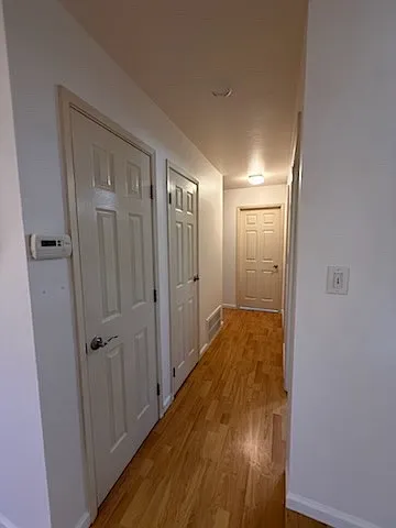 Hallway with three closets. Restroom is first door on the right. Master bedroom is for this door in the photo contains bathroom one. Bedroom two and three are left of master bedroom.