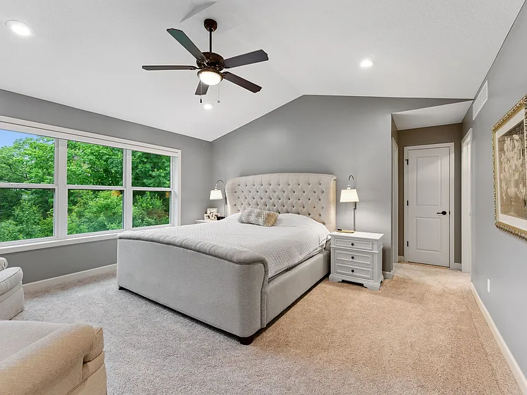Primary bedroom with walk-in closet and separate shoe closet