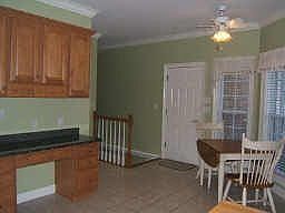 Breakfast area-notice the desk area and behind it is the laundry room. The sta