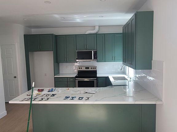 new kitchen with all appliances and big spacy countertops