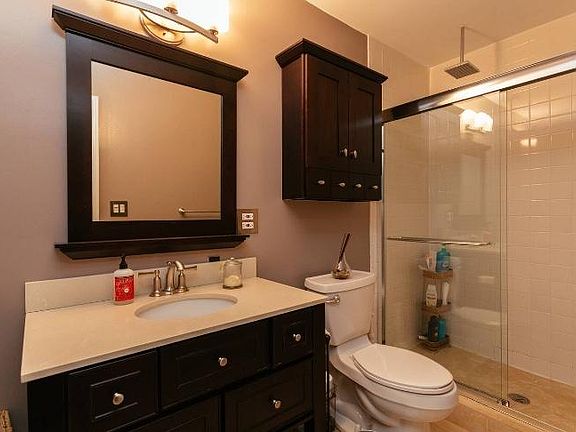 Rain fall shower plus dual shower in master. Plus separate