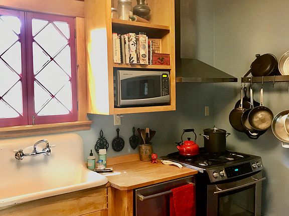 Another view of the kitchen. The Jennair range is gas. Pot rack is included.