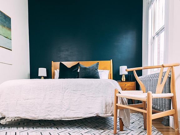 The "green room" includes a queen-sized bed and ample storage (two dressers and an oversized closet).