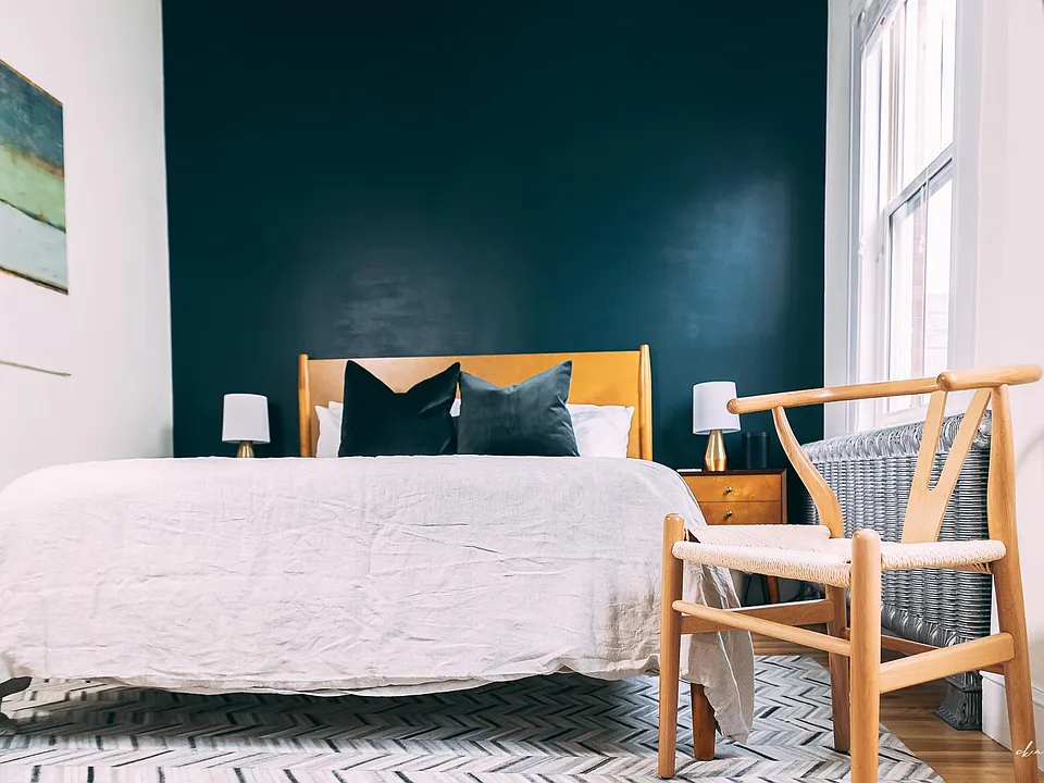 The "green room" includes a queen-sized bed and ample storage (two dressers and an oversized closet).