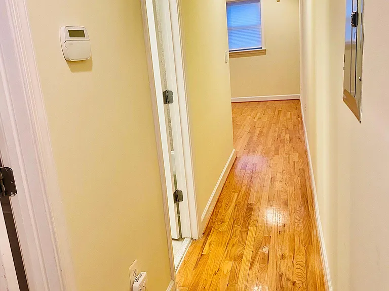 Upon entering, bedroom door is first on left, then bath (also connected by separate door to bedroom). Hallway leads to kitchen/living room at the end!