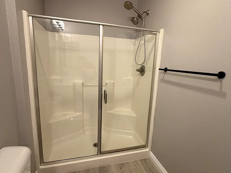 Stylishly renovated primary bathroom.
