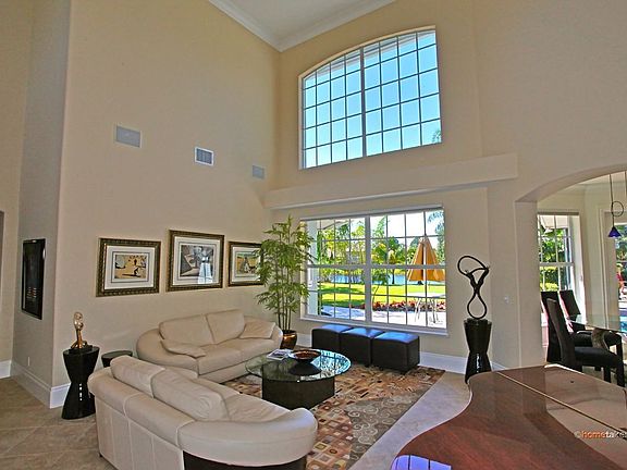 Living Room with View of Expansive Rear Yard and Canal