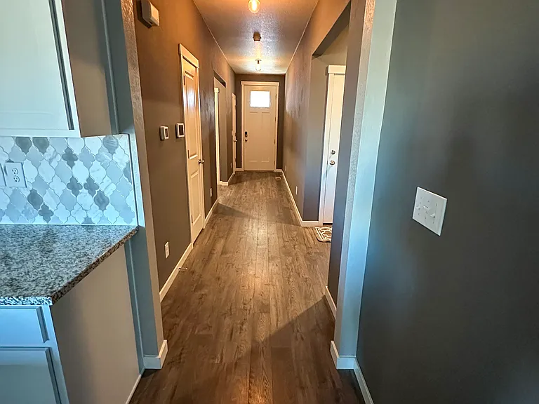Hallway with 3 closets