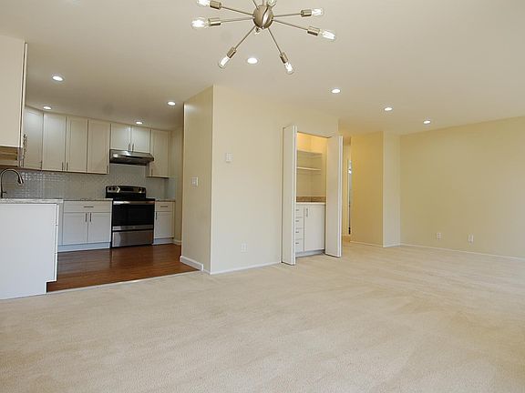Living Room + Dining Room + Kitchen (with hidden mini wet bar)