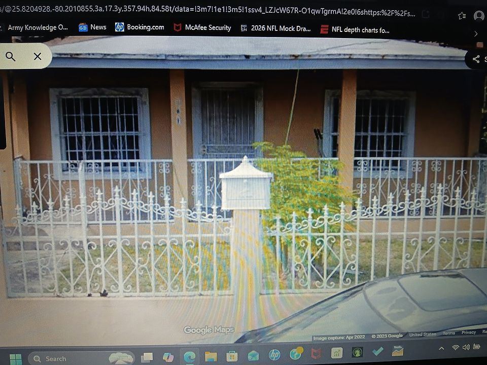 Facade South with front cement wall front gate. Property is very secure. One of the lowest crime rates in Miami Dade County.