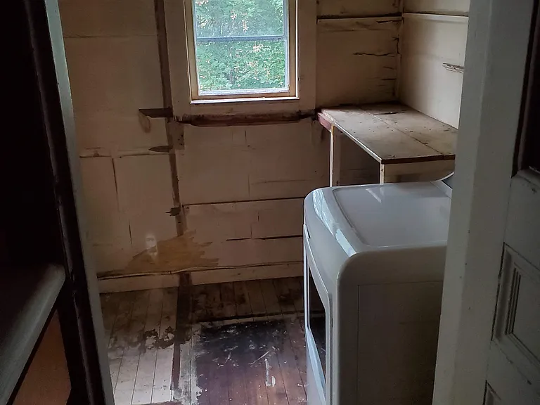 Dryer on back porch / unfinished storage area