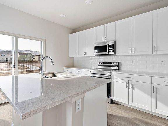 A view of the Kitchen and Oversized Island in the Neo