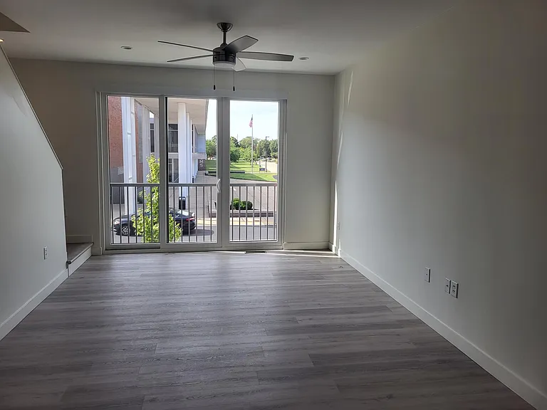 2nd floor- Living room- large windows- nice views- lots of natural sunlight