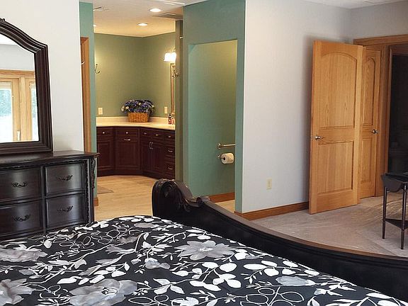 Master Bedroom with Large Master Bath Suite includes 6' Heated Jacuzzi Tub with 4 Head Shower. Corian His and Hers Sinks and Counter Tops, Separate Large Walk-In Shower with 3 Shower Heads.