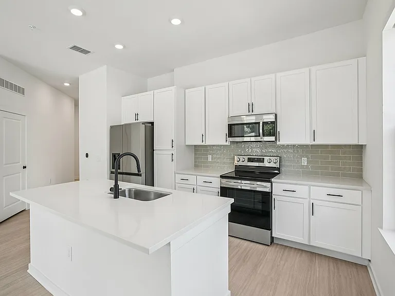 Open Kitchen with Stainless Steel Appliances