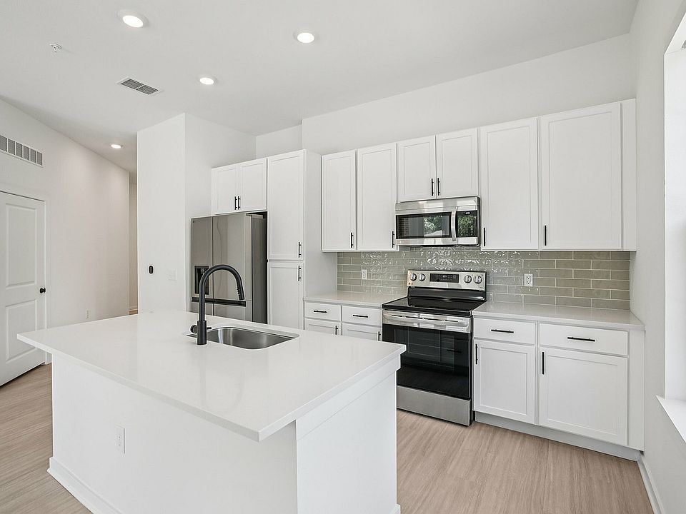 Open Kitchen with Stainless Steel Appliances