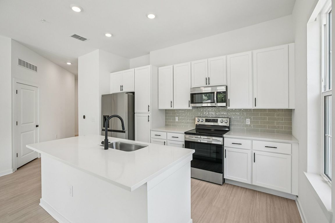 Open Kitchen with Stainless Steel Appliances