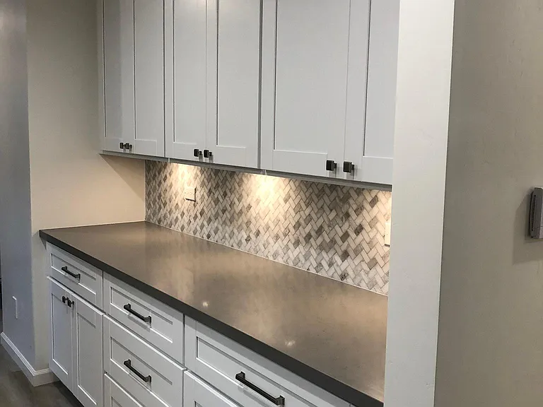 Lots of cabinet storage with underneath accent lighting.
