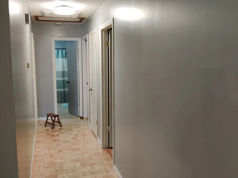 Main hallway with LED light closet and connects to 3 bedrooms and 2 bathrooms within the main house.