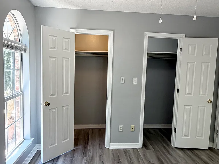Guest bedroom one with two walk-in closets