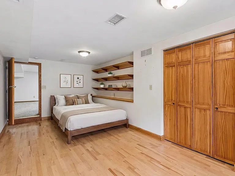 Lower level bedroom (AI staged)