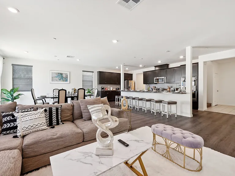 Spacious living room conveniently located near the dining area and kitchen.