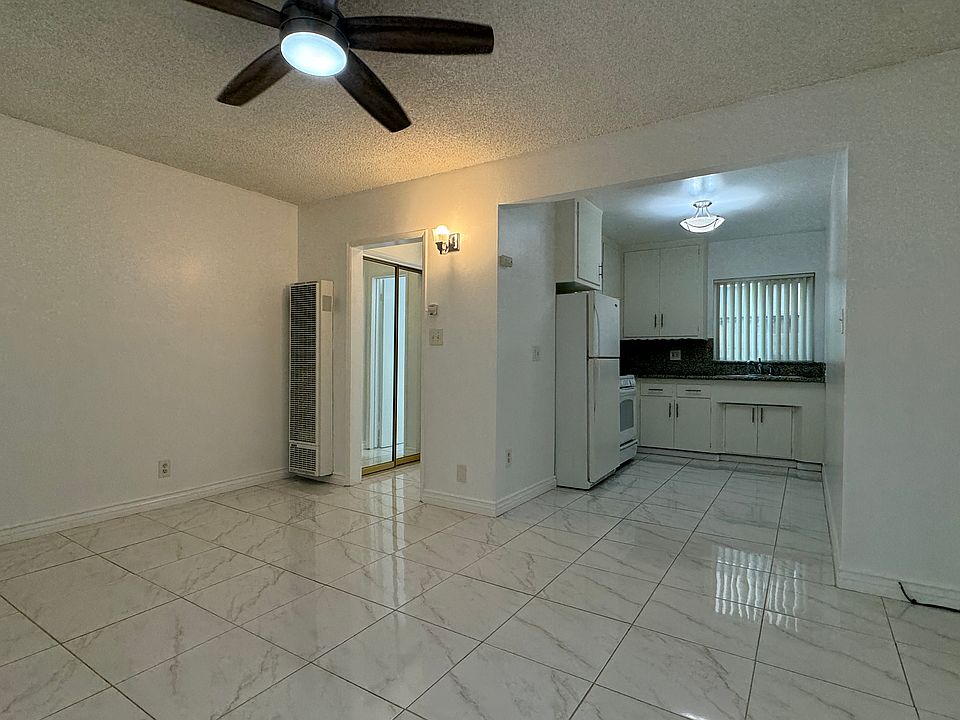 View of the entrance, kitchen and hall to the closet and bathroom.