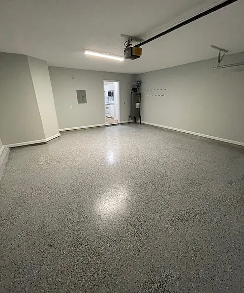 Fully redone 2 car attached garage with newly epoxy finished floor and paint and new lighting