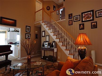 Living room with stairs to 2nd floor