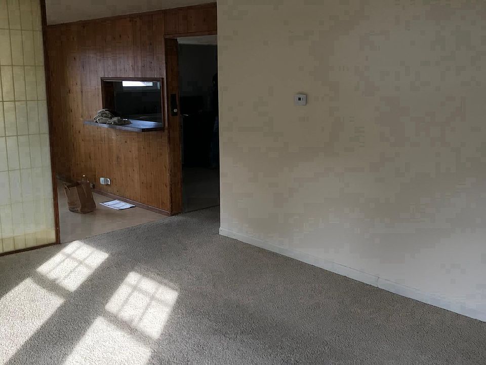 View from living room into dining room and kitchen