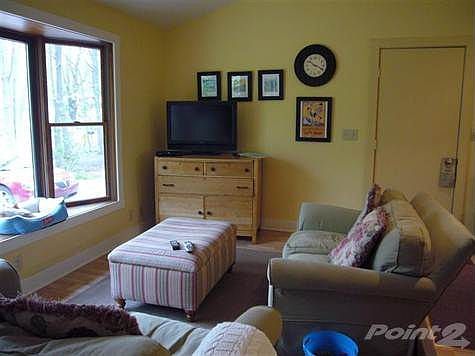Living space right off the kitchen to make it a great room feeling. Lots of natural light. Door on the right leads to the garage. Just pull in and you don't have far to carry those groceries into the kitchen!