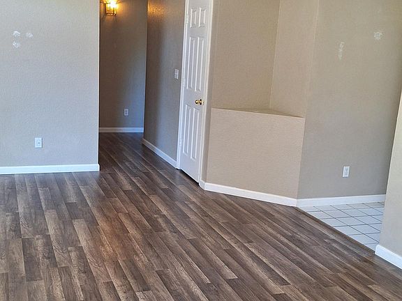 Open floor plan, showing high ceiling, shelf walls show detail for decorating.