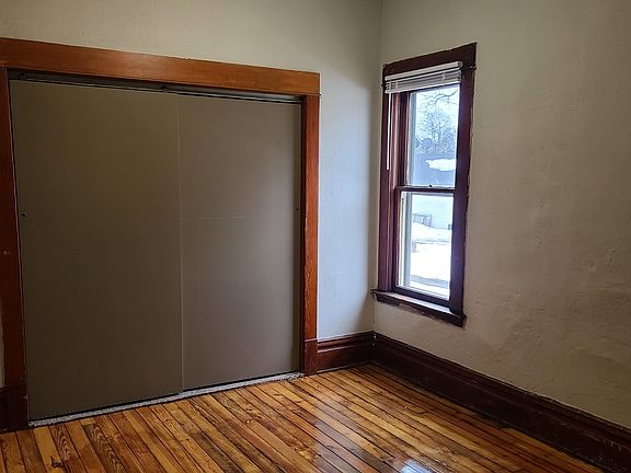second bedroom with large closed and refinished floors, new paint