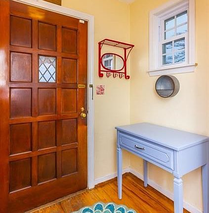 Inviting foyer with coat closet.