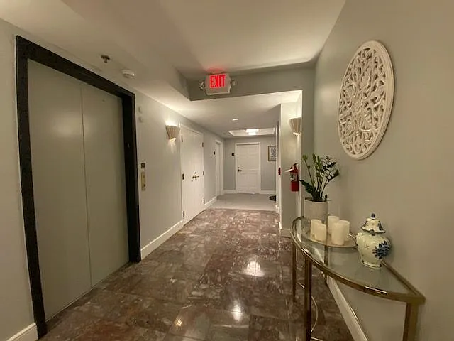 Another view of the hallway on the 4th floor and elevator.