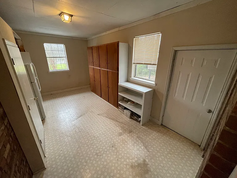Bonus Room (w/ shelves, storage space, and extra refrigerator)
