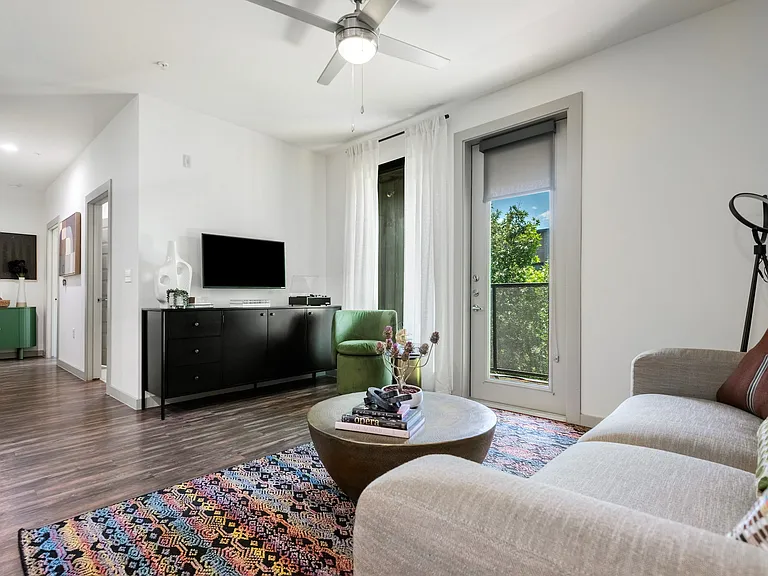 Bright Living Room with Modern Decor and Balcony Access