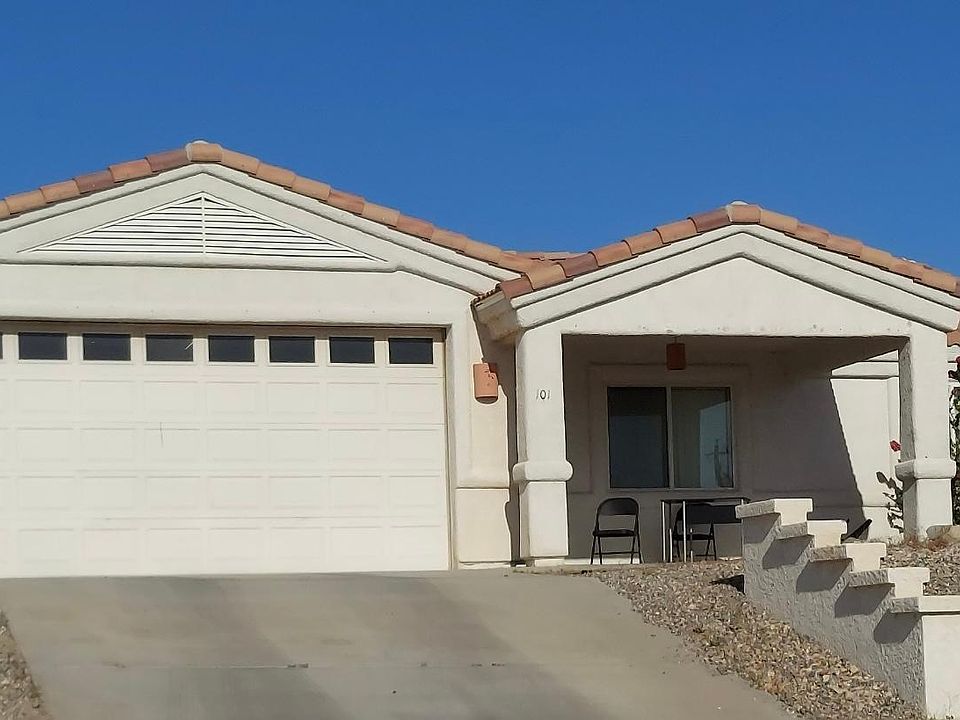 Lake facing front patio and 2 car garage with garage door opener