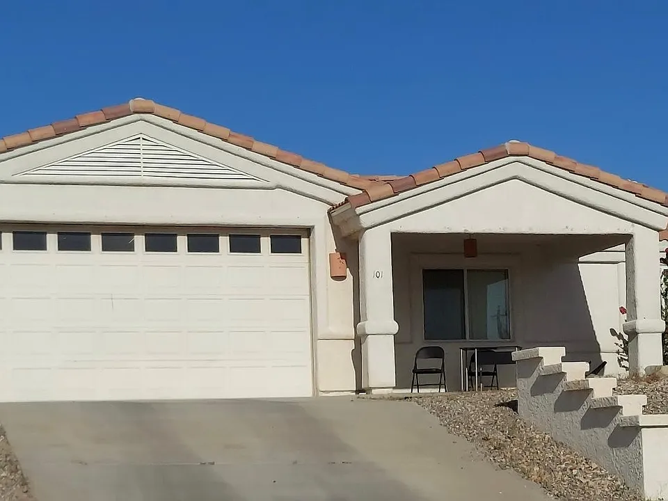 Lake facing front patio and 2 car garage with garage door opener