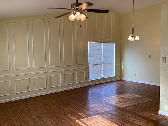 Large living room/dining room. High ceilings.
