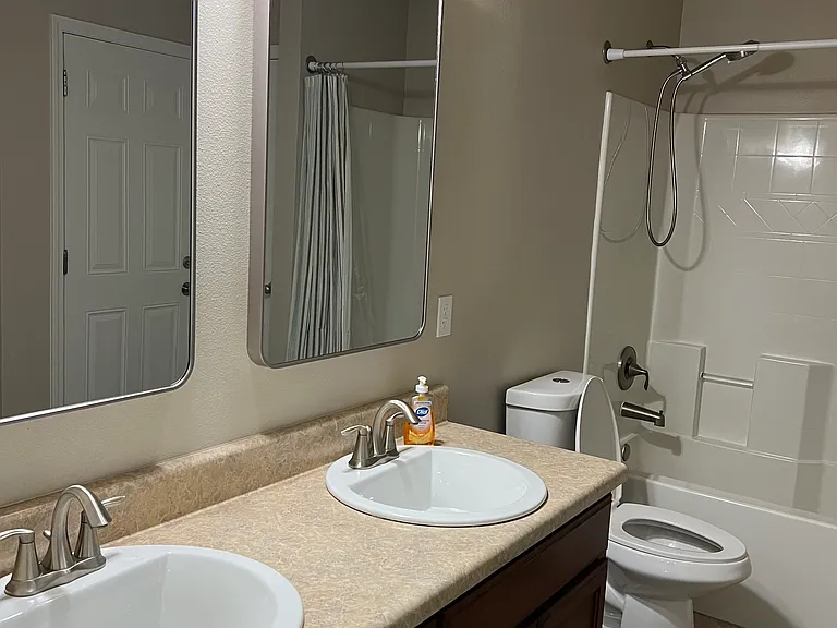 Secondary bathroom on other side of the house next to two bedroom number 2 and bedroom number 4 this house has a gorgeous split floor plan.