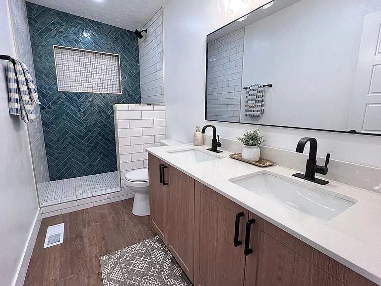 Shared bathroom with glass door.