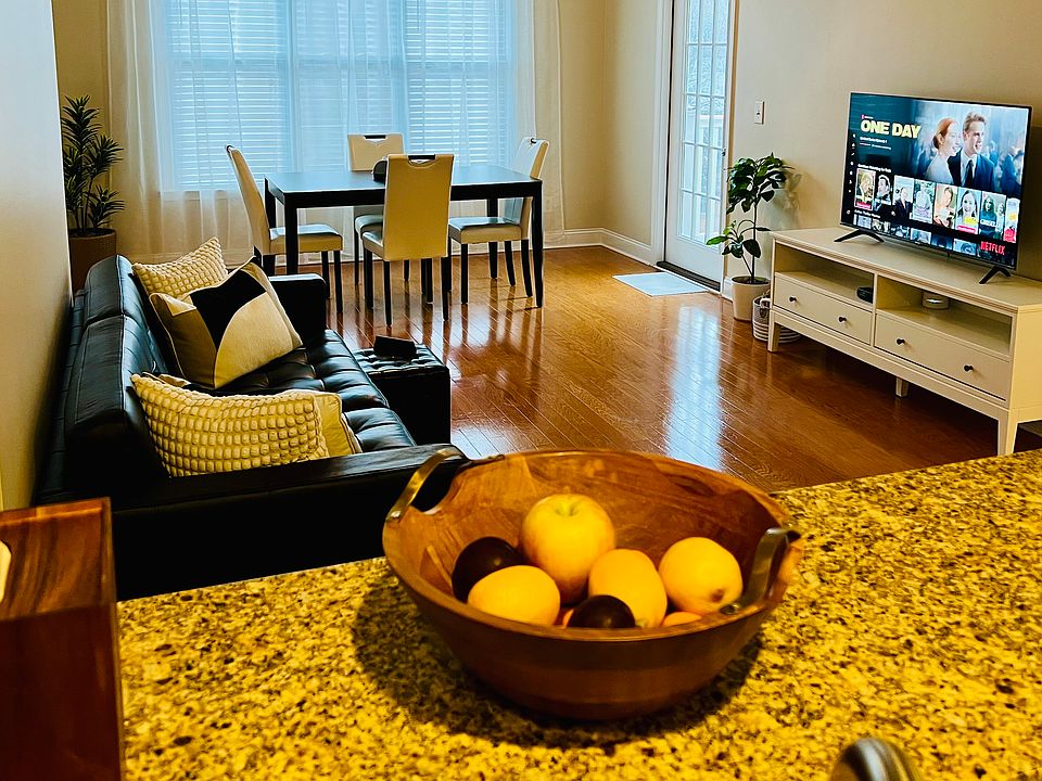 Viewing the cozy living room and dining room from the kitchen